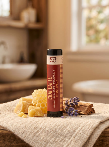 Chai Latte Lip Balm tube with honeycomb and lavender on a towel in a bathroom setting