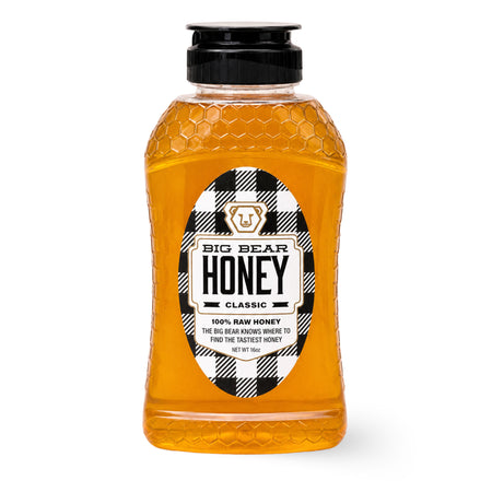 Bottle of Big Bear Honey with a checkered label on a white background