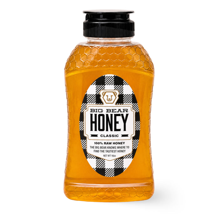 Bottle of Big Bear Honey with a checkered label on a white background