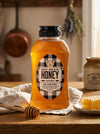 32 oz Bottle of Big Bear Honey on a wooden table with a checkered label