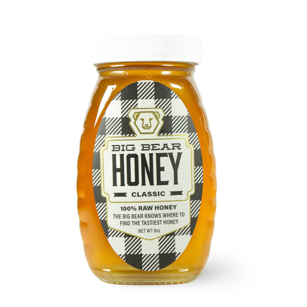Jar of Big Bear Honey with a checkered label on a white background