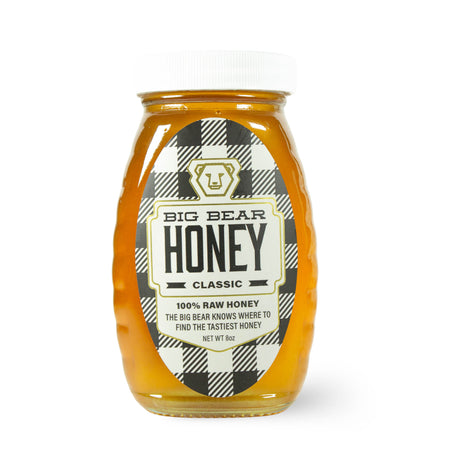Jar of Big Bear Honey with a checkered label on a white background