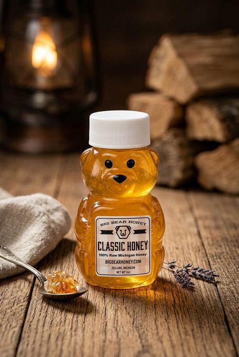 Bear-shaped honey jar with a label on a wooden surface with a warm background.