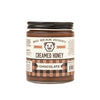 Jar of Big Bear Honey Creamed Honey Chocolate on a white background