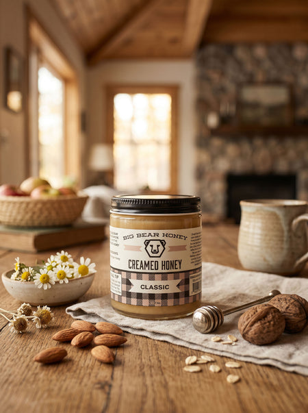 Jar of creamed honey on a wooden table with nuts and flowers in a rustic setting
