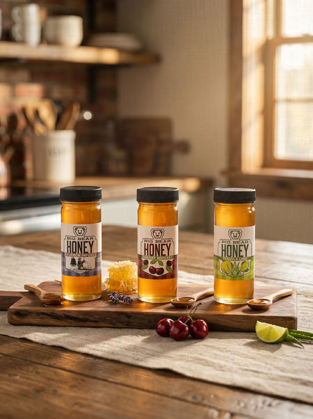 Three jars of honey on a wooden cutting board with kitchen background
