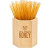 Bamboo container filled with honey sticks branded 'Big Bear Honey' on a white background.