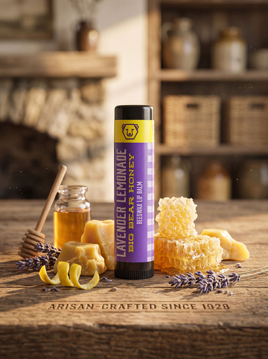 Lavender lemonade honey product on a wooden surface with honeycomb and lavender.