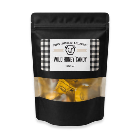 Black packaging of Big Bear Honey Wild Honey Candy on a white background