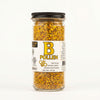 Jar of bee pollen with a label on a white background