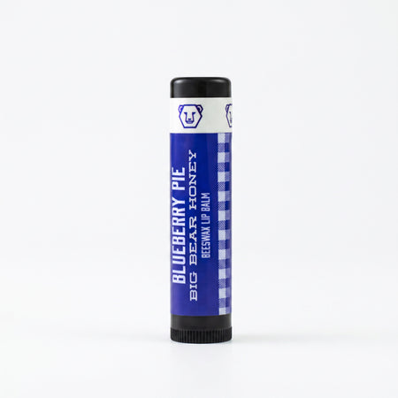 Blueberry Pie Lip balm tube with blue label and black cap on a white background