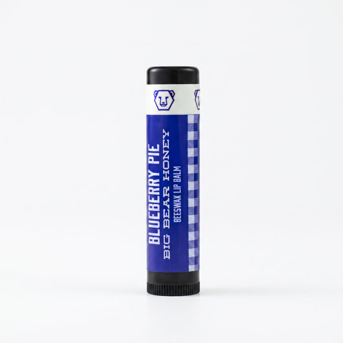 Blueberry Pie Lip balm tube with blue label and black cap on a white background