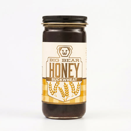 Jar of Big Bear Honey Buckwheat on a white background