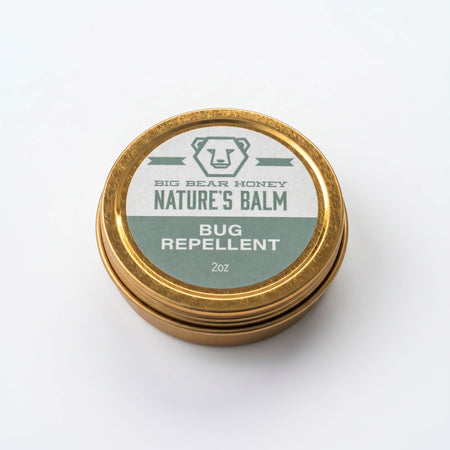 Gold container of Big Bear Honey Nature's Balm Bug Repellent on a white background