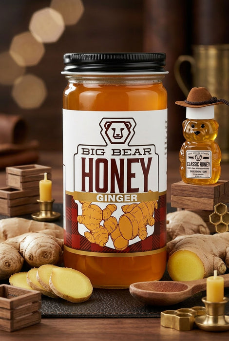 Jar of Big Bear Honey Ginger with ginger root and honey bear on a wooden table.