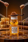 Honey bear bottle with honey drizzling from dipper on a wooden surface