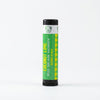 Coconut Lime lip balm tube with black cap on a white background