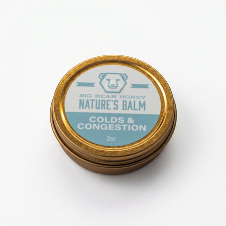 Gold tin labeled 'Nature's Balm' for colds and congestion on a white background
