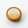 Gold tin of Big Bear Honey Nature's Balm for dry hands and feet on a white background