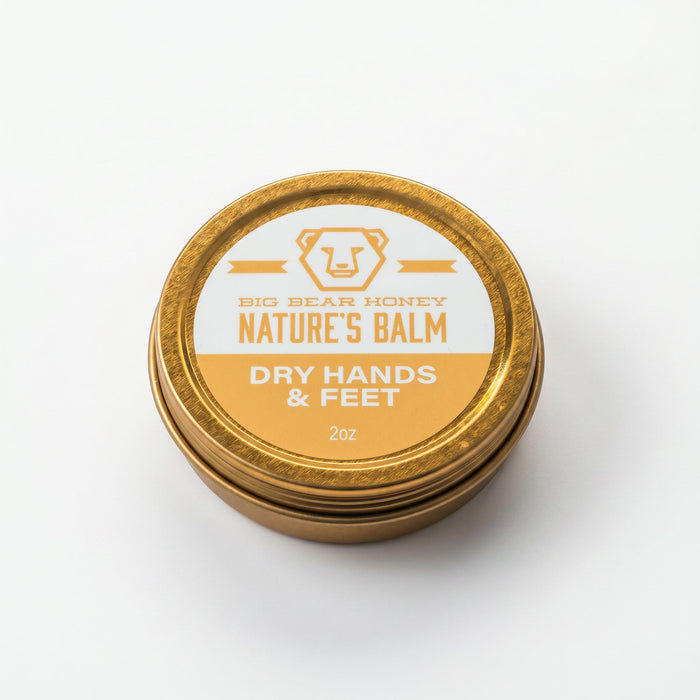 Gold tin of Big Bear Honey Nature's Balm for dry hands and feet on a white background