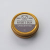 Unscented nature's balm jar with gold lid on a white background