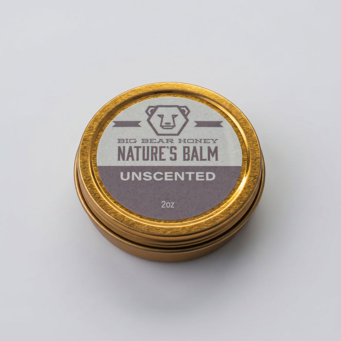Unscented nature's balm jar with gold lid on a white background