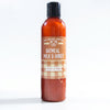 Bottle of oatmeal, milk, and honey body lotion on a white background
