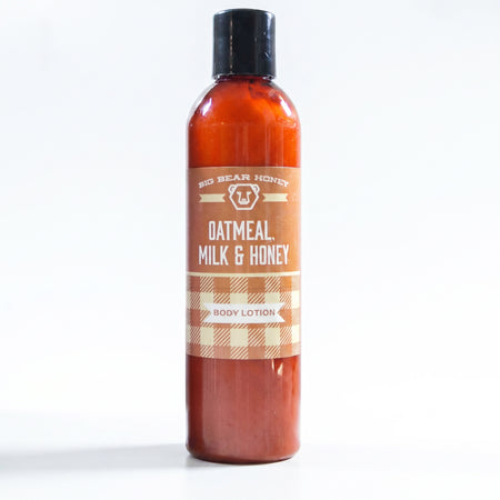 Bottle of oatmeal, milk, and honey body lotion on a white background
