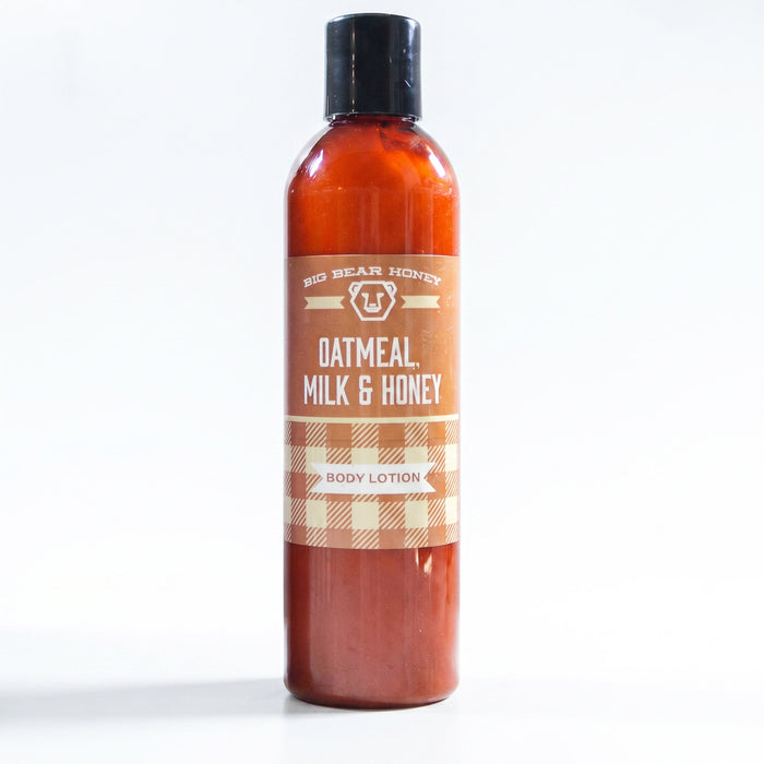 Bottle of oatmeal, milk, and honey body lotion on a white background