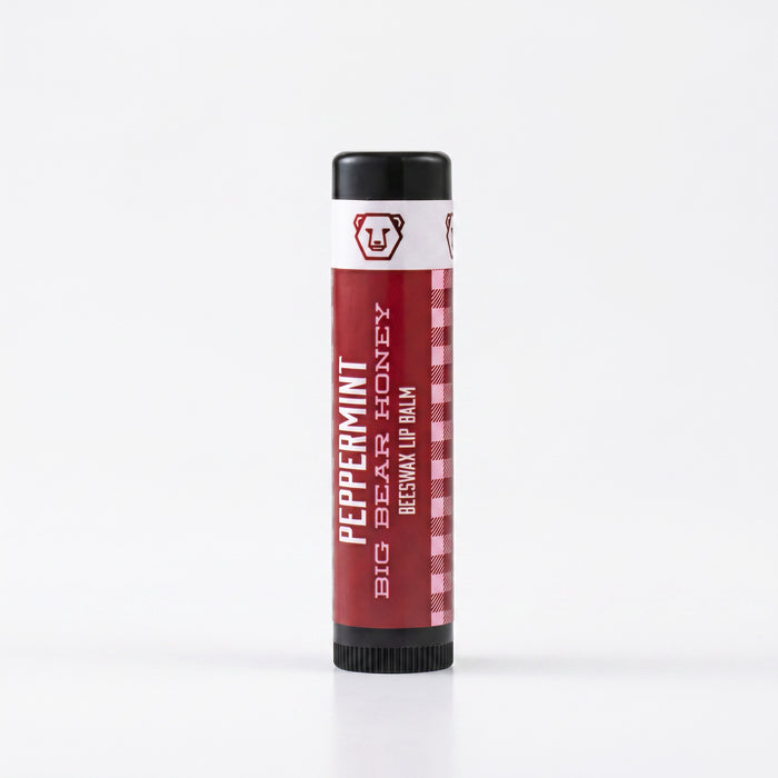 Lip balm with red and white packaging on a white background