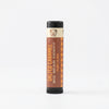 Lip balm tube labeled 'Salted Caramel' on a white background