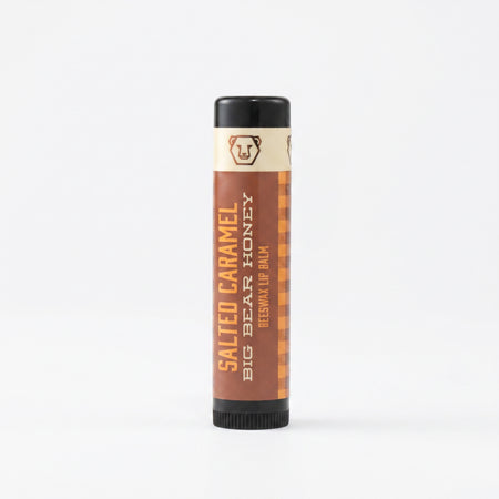 Lip balm tube labeled 'Salted Caramel' on a white background