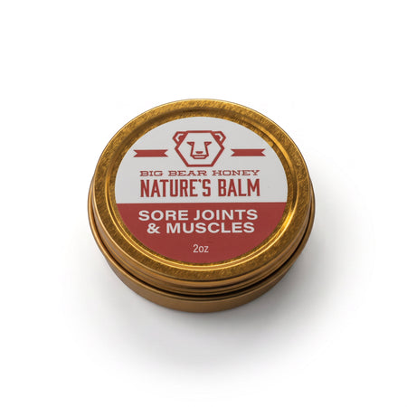 Gold tin of Big Bear Honey Nature's Balm for sore joints and muscles on a white background