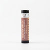 Tahitian Vanilla lip balm with a checkered pattern on a white background