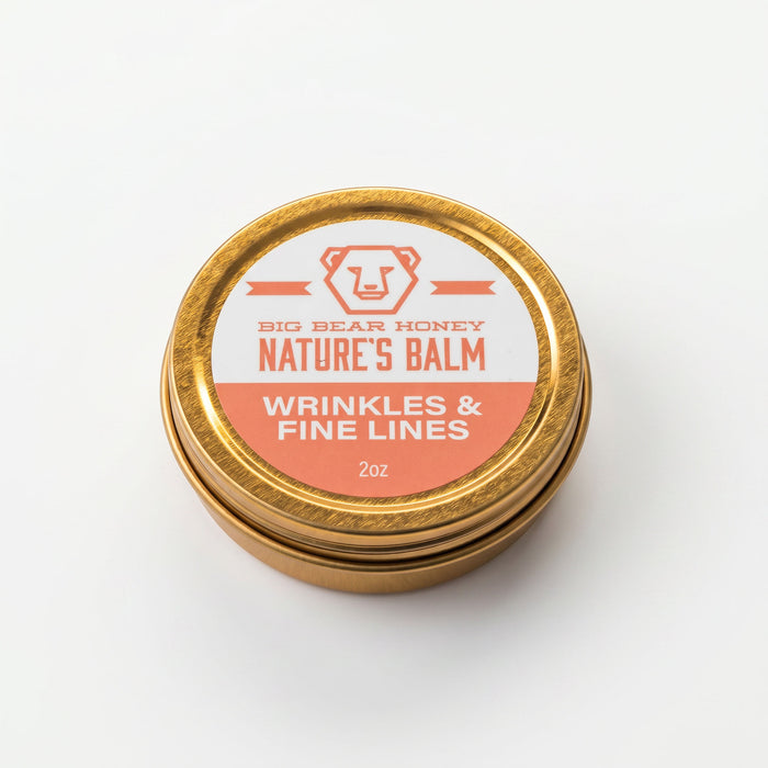 Gold tin of Big Bear Honey Nature's wrinkles & fine Lines Balm with a white label on a white background